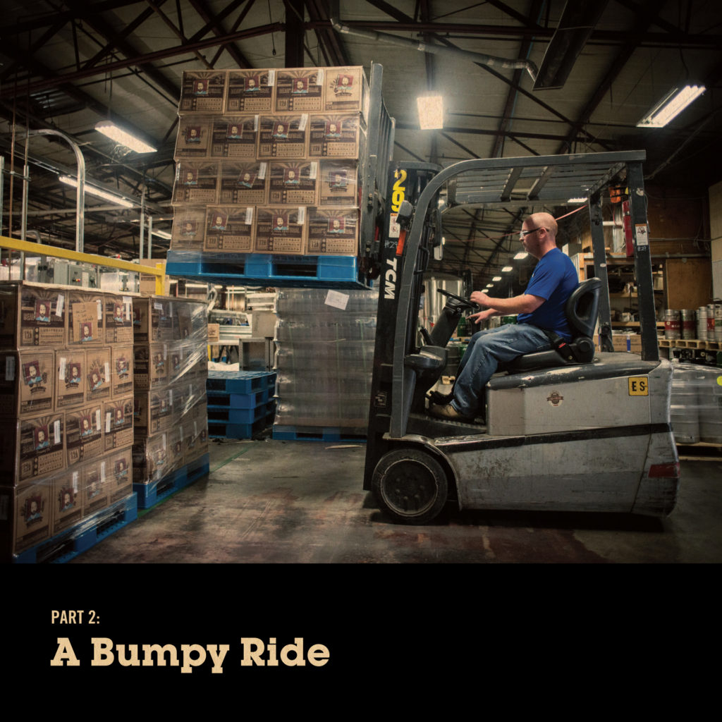 A forklift driver with a palette of beer. "Part 2: A Bumpy Ride